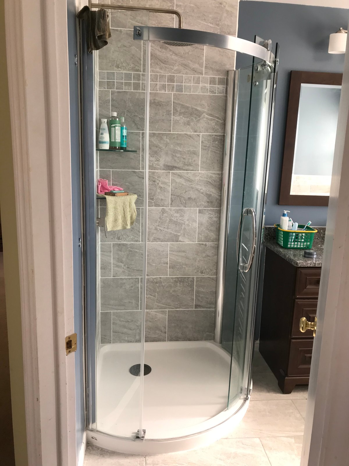 Glass shower enclosure with tiled surround